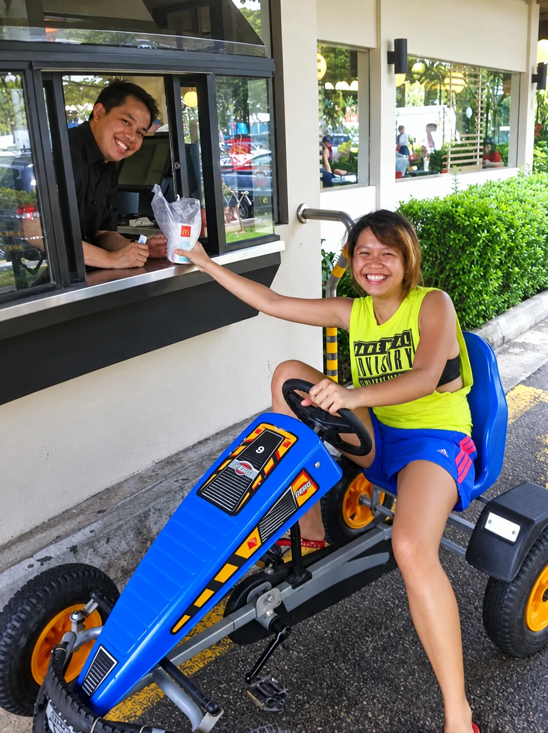Pedal go-kart rider moving through an event activity area in Singapore